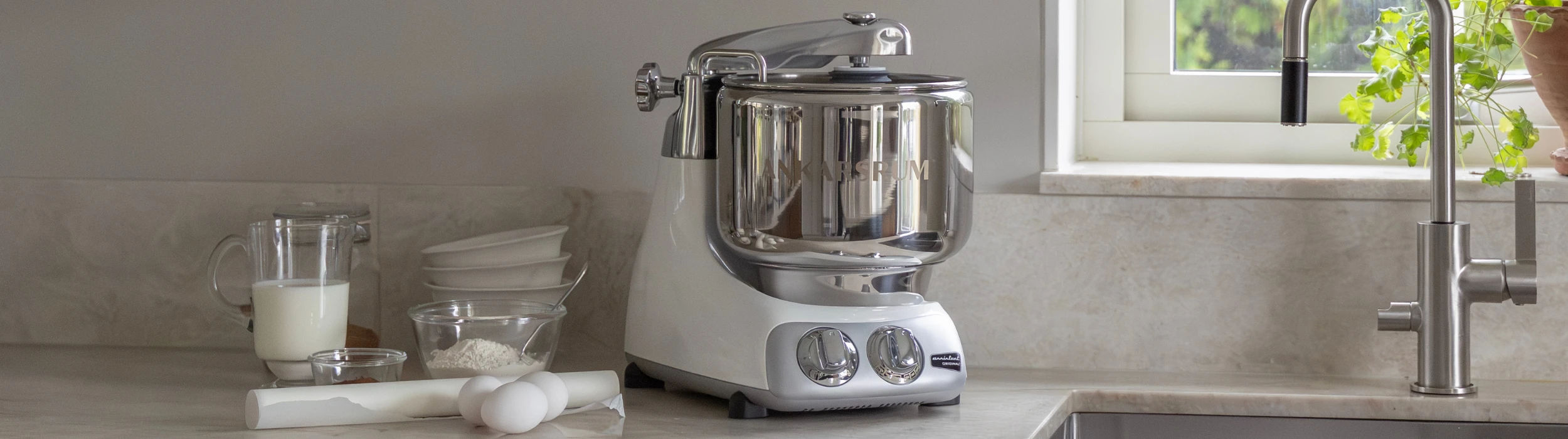 The elegant Ankarsrum stand mixer on a stylish kitchen bench, reflecting decades of Swedish craftsmanship and premium quality.